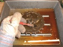 Use degreaser to remove oil deposits before you start painting.